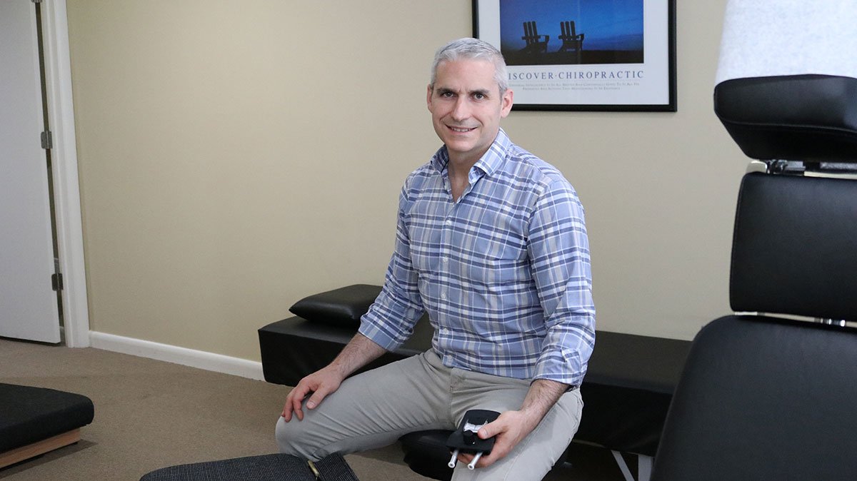 Doctor Anthony Noya sitting in his office